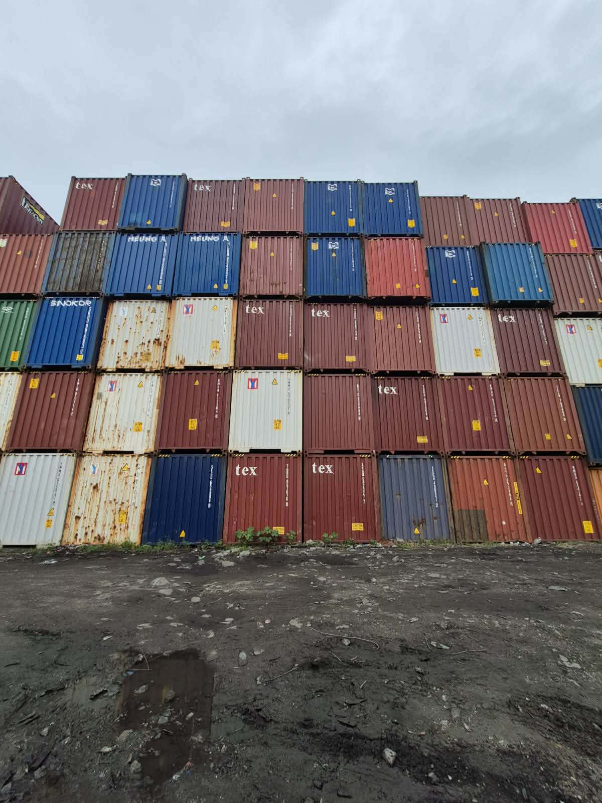 Wall of stacked containers in the yard